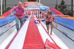 strongest man double lanes bungee games inflatable bungee run 2 lanes for sale