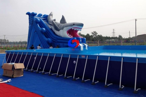 commercial movable large above ground metal frame swimming pools with big shark inflatable water slides for sale