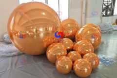 wedding corporate event balloons backdrop decor oversized big shiny giant golden orange inflatable mirror balls/spheres